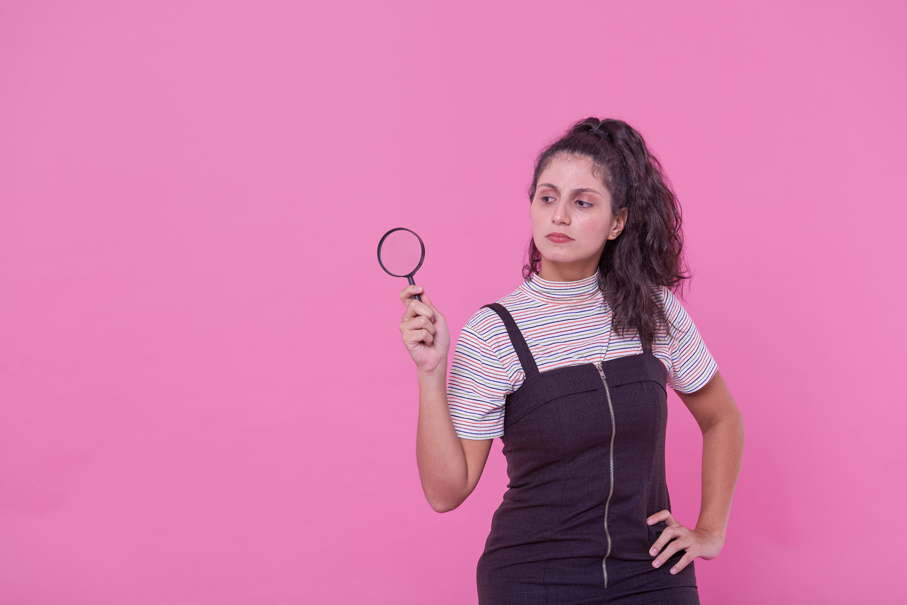 Bold & Punchy Headshots Young Woman Holding Magnifying Glass